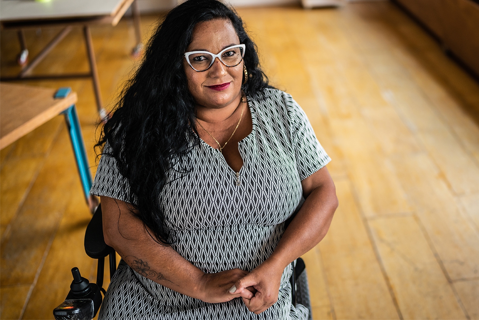 Portrait of disabled mature woman in a wheelchair at work