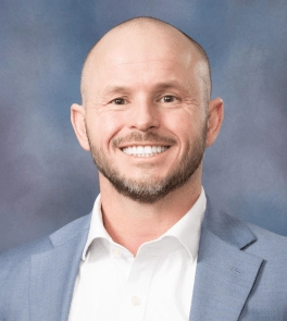 Jake Childs, PharmD, M.S., M.H.A, F.A.C.H.E.